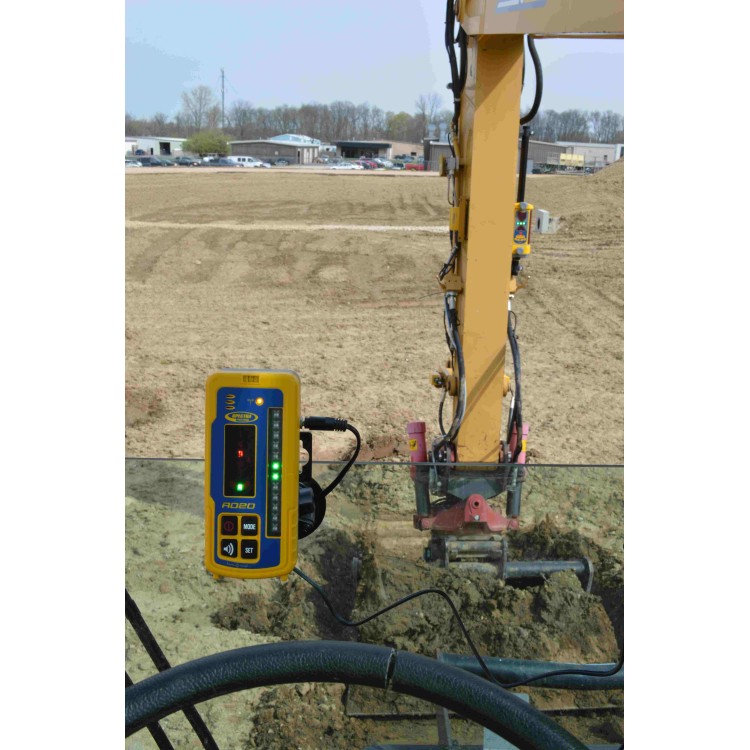 Spectra RD20 in-cab display showing on-grade while the excavator digs a trench