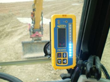 Spectra RD20 wireless remote display mounted in an excavator cab